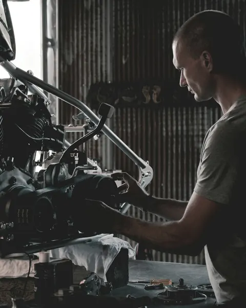 A mechanic working on an engine